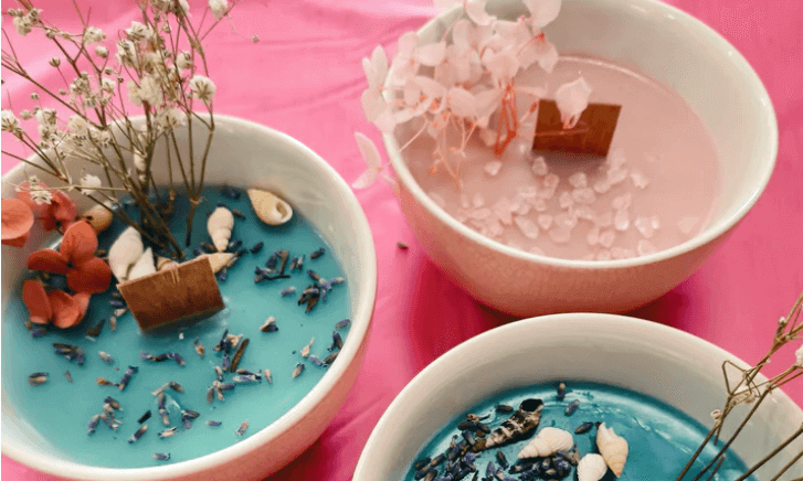 three soy candles in little ramkin dishes