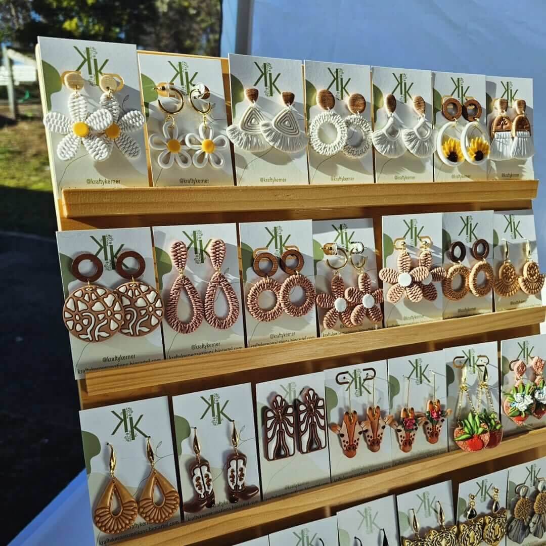 a collection of geometrical shaped earrings on a stand