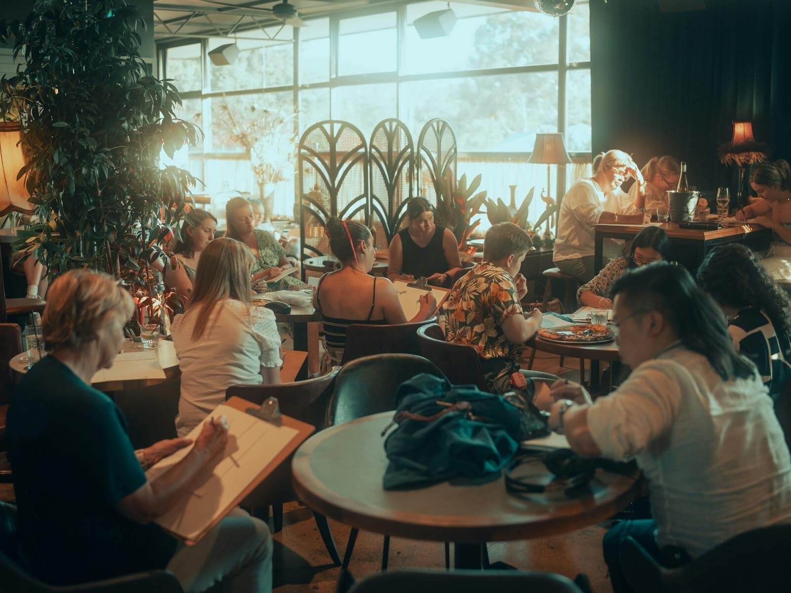 Close up image of participants engaging in drawing at Bar Toto in Ettalong