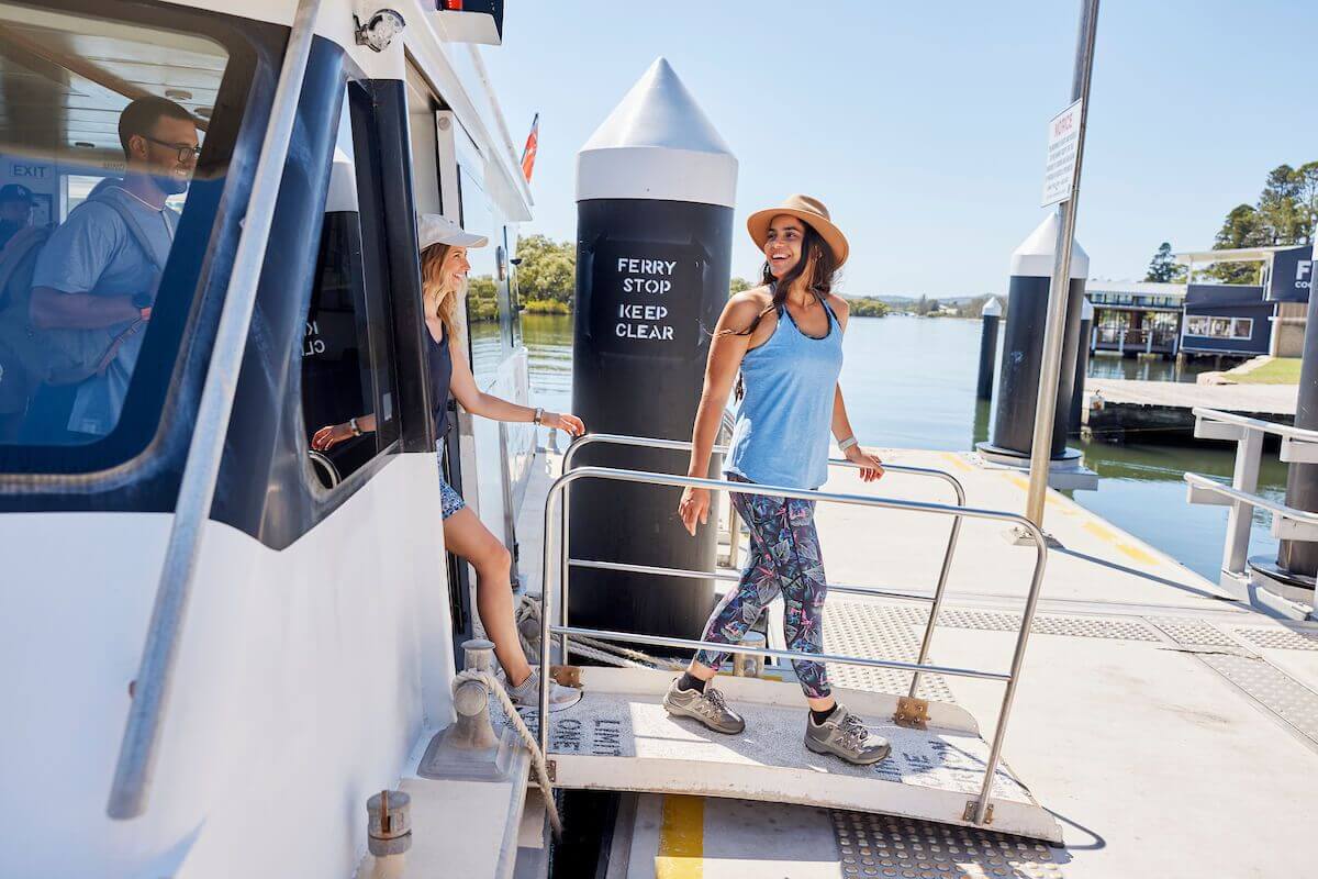 friends getting off ferry at woy woy