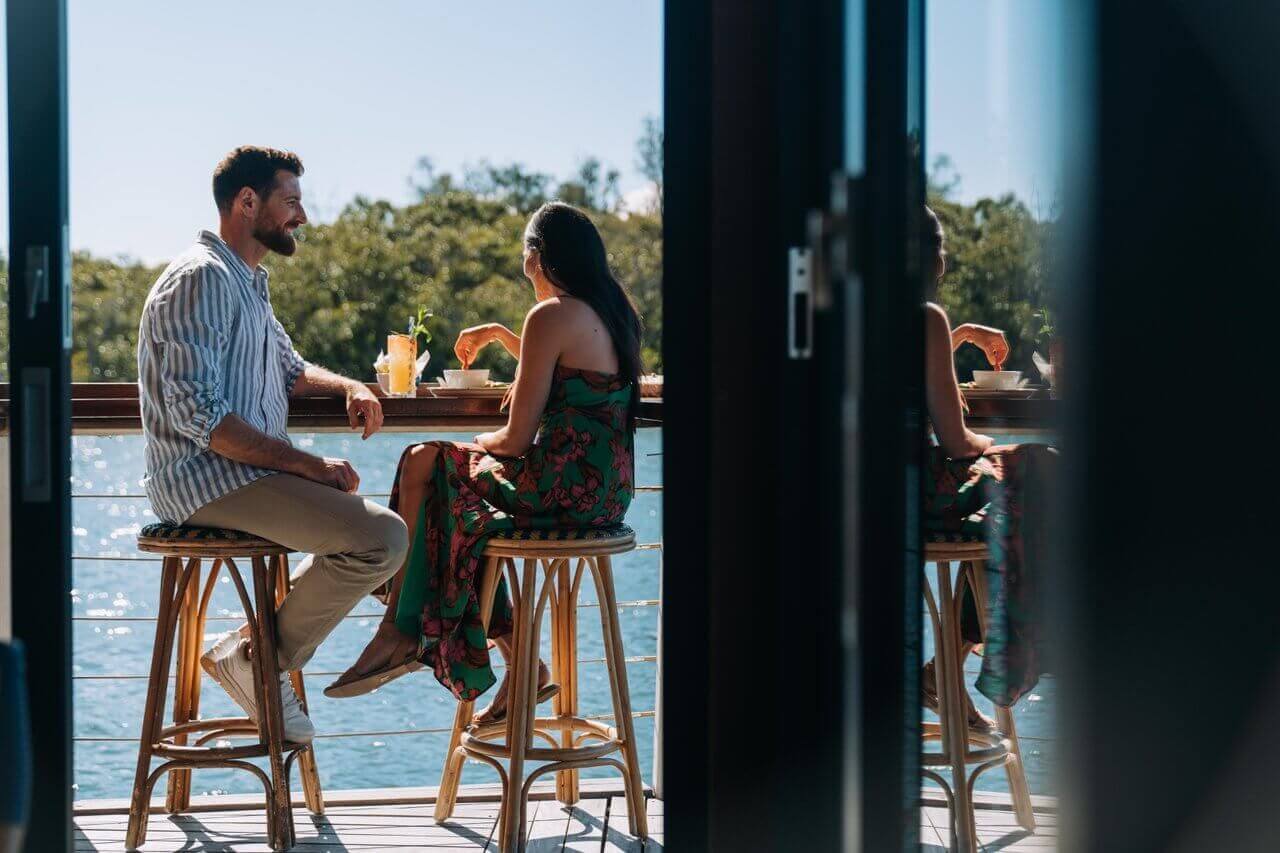 couple dine on the water