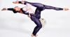 Duo AussieBela lifting partner in a horizontal pose during a choreographed routine